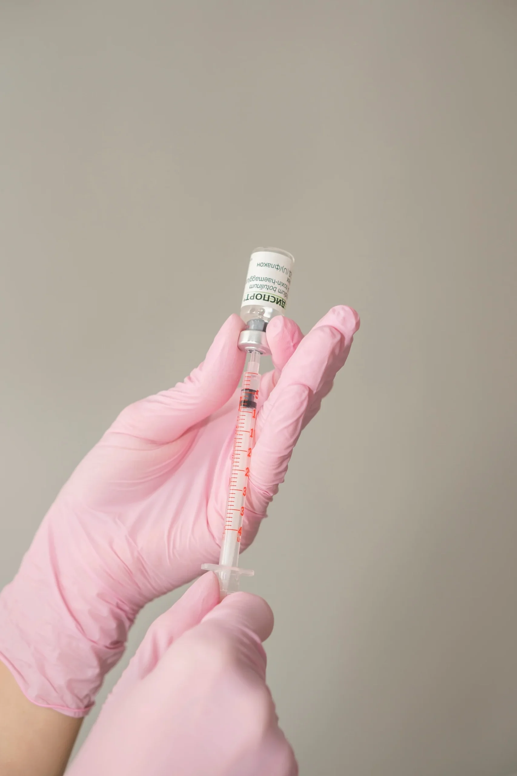 Administering a neuromodulator injection for natural facial rejuvenation in a Houston aesthetic spa.