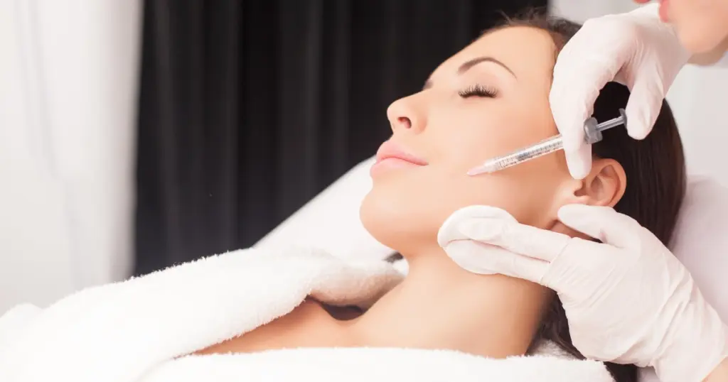 Woman receiving Dermal Fillers injection in clinic for facial treatment in Houston, TX
